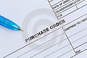 Purchase order with blue pen in the officeÃ¢â¬Â